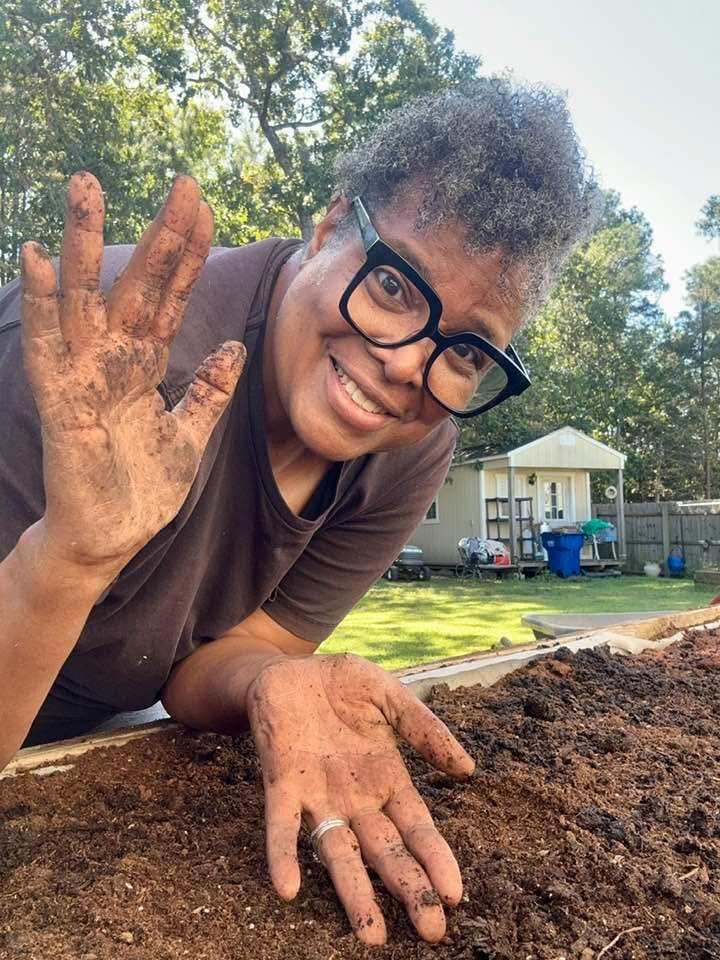 Carol Brown — hands in the soil of her garden